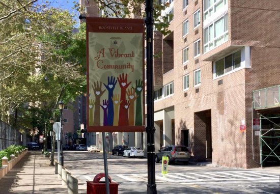 Continuing Saga of RIOC and Its (Absence of) Signs Lamppost banners like this one can be better used, according to Roosevelt Island historian Judy Berdy.