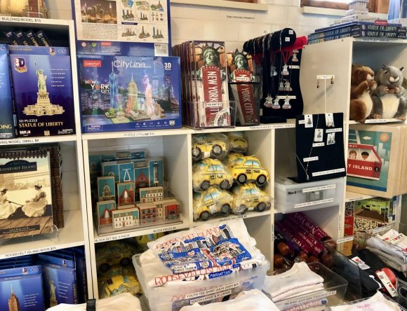 Small Business Saturday, Shop Our Smallest: Roosevelt Island Historical Society Kiosk Something for everyone, shelves filled with New York and Roosevelt Island themed gifts and souvenirs.