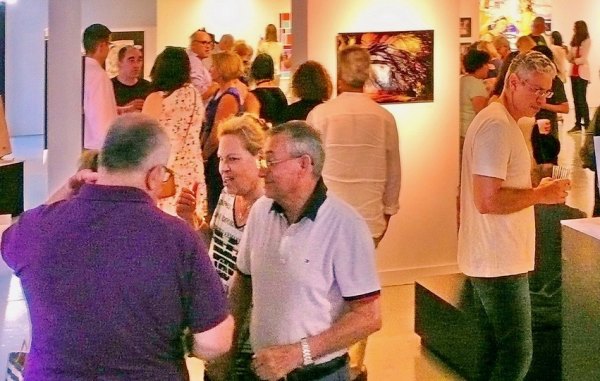 Seen at "Free Time," RIVAA Gallery Opening Inside, the atmosphere was friendly as like minded folks relaxed with the art.