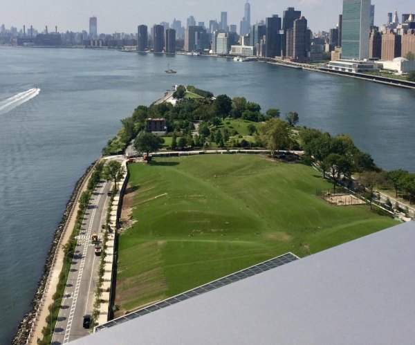 September 13th, 10:30 A.M., Cornell Tech Campus Dedication-An Early Look Looking south from the highest vantage point on campus, green spaces waiting for the next phase, Southpoint and FDR Four Freedoms Parks taper into the waters near the United Nations.