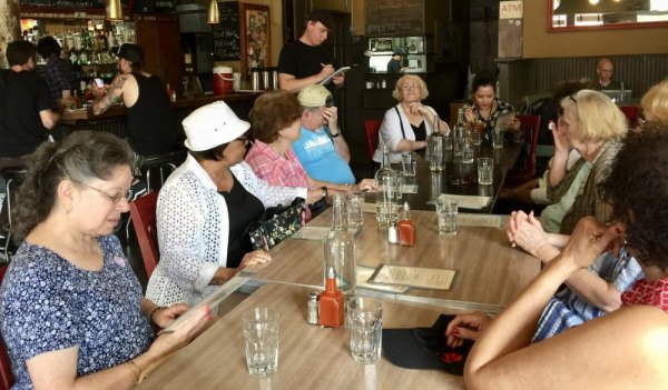 Roosevelt Island Seniors Hit The Road, Thanks To CBN And Anonymous Sponsor Before: RI Seniors at the Museum of Food and Drink contemplate their orders.